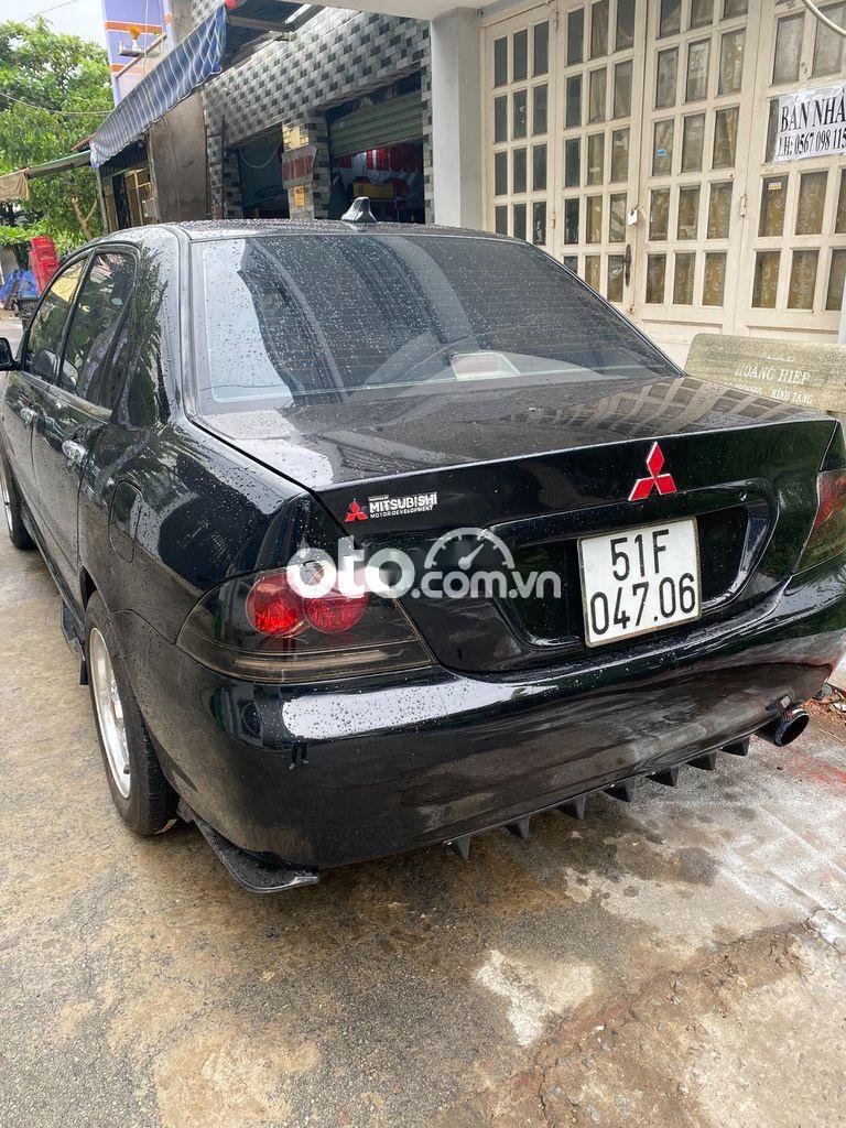 Mitsubishi Lancer 2003 - Bán ô tô Mitsubishi Lancer năm sản xuất 2003, màu đen số tự động, 185tr