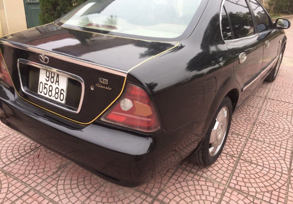 Daewoo Magnus 2004 - Bán ô tô Daewoo Magnus sản xuất năm 2004, màu đen 