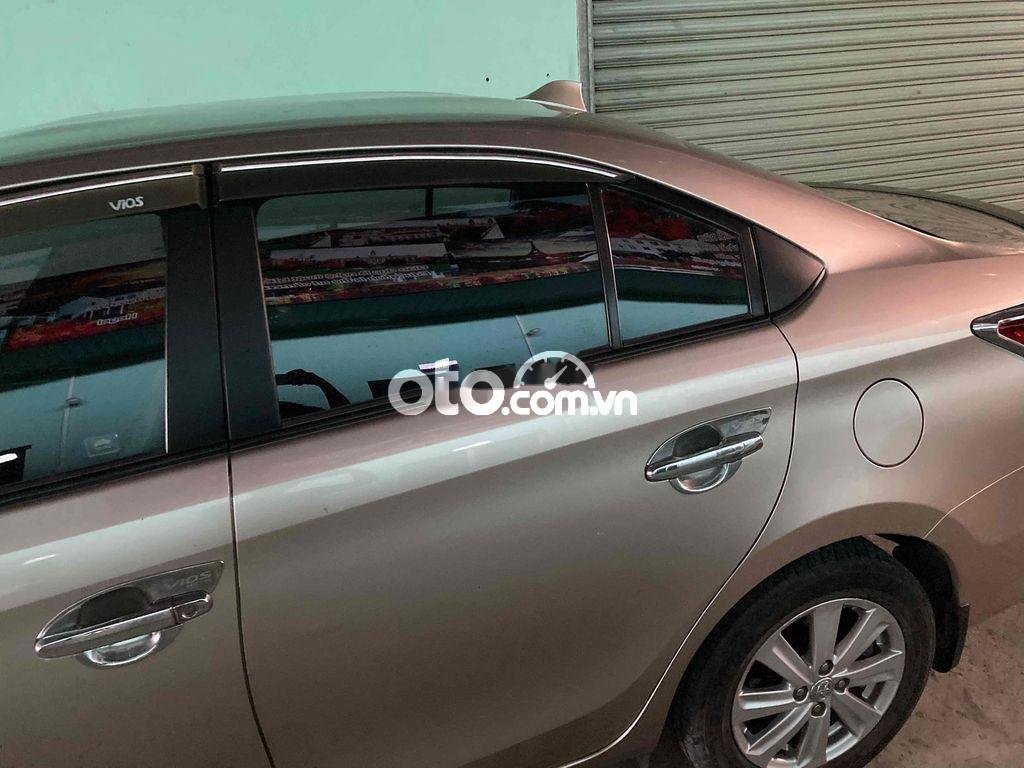 Toyota Vios 2015 - Bán ô tô Toyota Vios 1.5G AT sản xuất năm 2015, màu xám xe gia đình, giá 410tr