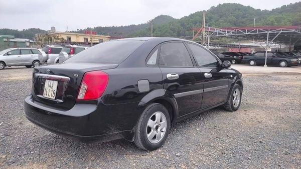 Daewoo Lacetti 2010 - Bán ô tô Daewoo Lacetti EX năm 2010, màu đen xe gia đình, 165 triệu