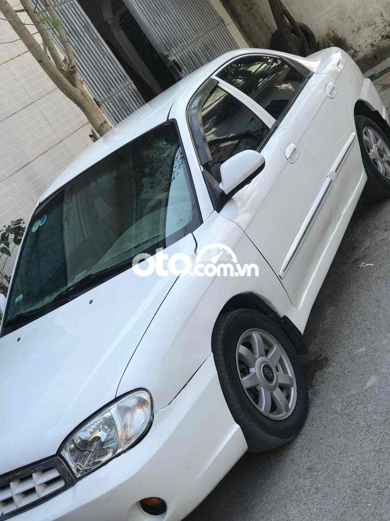 Kia Spectra 2004 - Bán xe Kia Spectra sản xuất 2004, màu trắng, nhập khẩu, giá 100tr