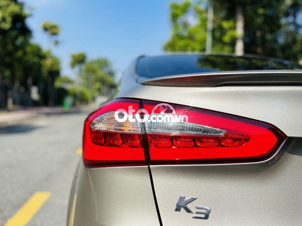 Kia K3 2014 - Cần bán lại xe Kia K3 1.6MT sản xuất 2014, màu vàng, xe nhập, 368 triệu