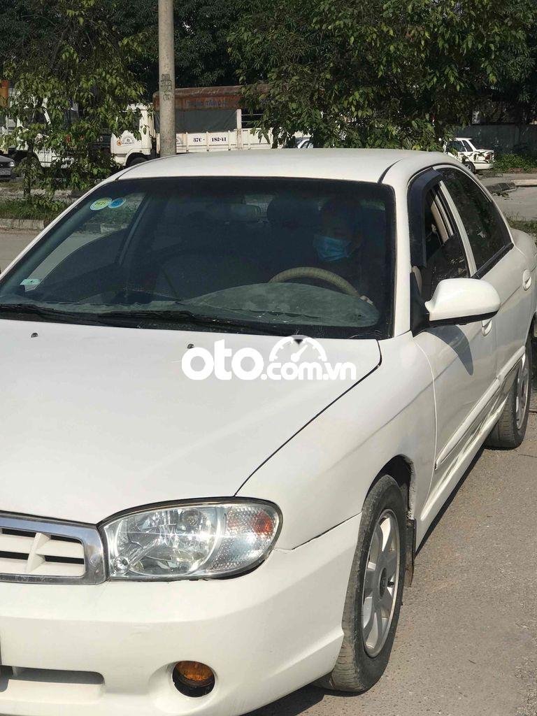 Kia Spectra 2004 - Bán xe Kia Spectra sản xuất 2004, màu trắng, nhập khẩu, giá 100tr