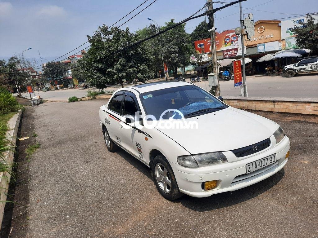 Mazda 323 2000 - Màu trắng