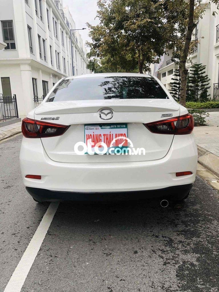 Mazda 2 2016 - Cần bán lại xe Mazda 2 1.5AT sản xuất năm 2016, màu trắng chính chủ