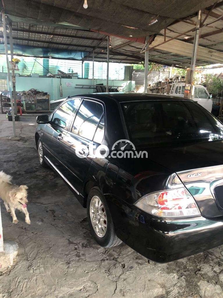 Mitsubishi Lancer 2005 - Màu đen, xe nhập, số sàn