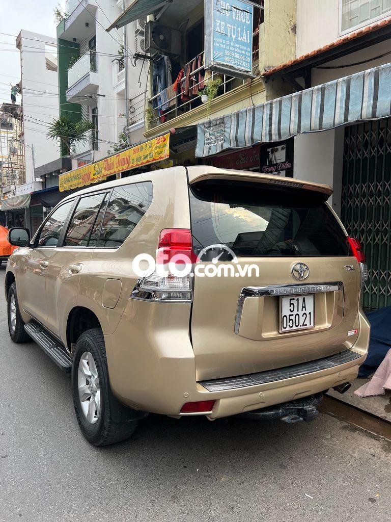 Toyota Land Cruiser Prado TXL 2010 - Bán xe Toyota Land Cruiser Prado TXL sản xuất năm 2010, màu vàng, nhập khẩu nguyên chiếc