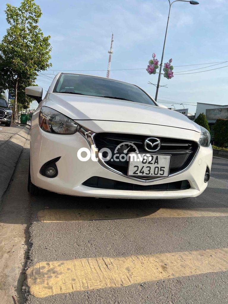 Mazda 2 Xe gia đình cần bán gấp 2015 - Xe gia đình cần bán gấp