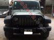 Jeep Wrangler Unlimited Sport 2010 - Cần bán gấp Jeep Wrangler Unlimited Sport 2010, màu đen, xe nhập chính chủ