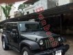 Jeep Wrangler Unlimited Sport 2010 - Cần bán gấp Jeep Wrangler Unlimited Sport 2010, màu đen, xe nhập chính chủ