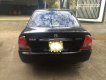 Mazda 323F 1.6 MT 2004 - Em cần bán xe Mazda 323F 1.6 MT sản xuất 2004, màu đen xe gia đình
