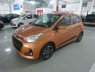 Hyundai Grand i10 2018 - Bán xe Hyundai Grand i10 sx 2018 màu cam bản đủ, giá tốt nhất. LH 090.467.5566