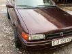 Mazda 323 1988 - Cần bán gấp Mazda 323 sản xuất 1988, màu nâu