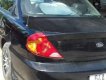 Kia Spectra 2004 - Cần bán gấp Kia Spectra đời 2004, màu đen xe gia đình