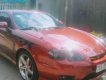 Hyundai Tuscani 2.0MT 2005 - Cần bán Hyundai Tuscani 2.0MT năm 2005, màu đỏ, xe nhập xe gia đình giá cạnh tranh