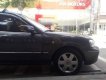 Ford Laser  Ghina 1.8 2002 - Bán Ford Laser Ghina 1.8 đời 2002, màu đen