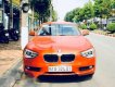 BMW 1 Series  116i  2014 - Chính chủ bán BMW 1 Series 116i đời 2014, màu cam