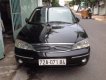 Ford Laser Ghia 1.8  2004 - Bán Ford Laser Ghia 1.8 năm 2004, màu đen số sàn