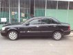 Ford Laser Ghia 1.8  2004 - Bán Ford Laser Ghia 1.8 năm 2004, màu đen số sàn