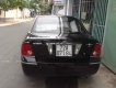 Ford Laser Ghia 1.8  2004 - Bán Ford Laser Ghia 1.8 năm 2004, màu đen số sàn