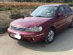 Ford Laser Ghia 1.8 MT 2003 - Cần bán lại xe Ford Laser Ghia 1.8 MT sản xuất 2003, màu đỏ