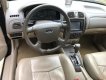 Ford Laser 1.8AT 2004 - Cần bán gấp Ford Laser 1.8AT đời 2004, màu đen, 250tr
