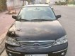 Ford Laser   1.8 GHIA  2004 - Gia đình bán Ford Laser 1.8 GHIA đời 2004, màu đen