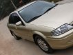 Ford Laser Delu 2001 - Cần bán xe Ford Laser Delu năm 2001, màu vàng