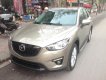 Mazda CX 5 2WD 2013 - Cần bán xe Mazda CX-5, sản xuất và đăng ký 2013 mầu vàng cát. Giá 665 triệu