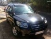 Hyundai Santa Fe 4x4 2007 - Cần bán Hyundai Santa Fe 4x4 đời 2007, màu đen, nhập khẩu, số tự động