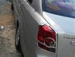 Daewoo Lacetti EX 1.6 MT 2005 - Cần bán gấp Daewoo Lacetti EX 1.6 MT năm sản xuất 2005, màu bạc