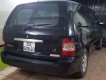 Kia Carnival 2005 - Cần bán Kia Carnival năm sản xuất 2005, màu đen xe gia đình, giá chỉ 340 triệu