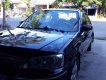 Ford Laser GHIA 1.8 MT 2003 - Bán Ford Laser GHIA 1.8 MT năm 2003, màu đen, giá 200tr