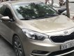 Kia K3   1.6 MT  2014 - Bán Kia K3 1.6 MT năm 2014, màu vàng cát