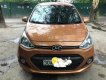 Hyundai Grand i10 2015 - Bán Hyundai Grand i10 năm sản xuất 2015, màu đồng