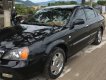 Daewoo Magnus 2.5 AT 2004 - Cần bán xe Daewoo Magnus 2.5 AT đời 2004, màu đen