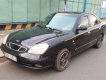 Daewoo Nubira CDX 2.0 1998 - Cần bán xe Daewoo Nubira CDX 2.0 đời 1998, màu đen xe gia đình