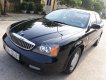 Daewoo Magnus SX 2005 - Cần bán xe Daewoo Magnus SX đời 2005, màu đen