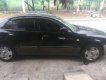 Daewoo Magnus 2004 - Bán ô tô Daewoo Magnus năm 2004, màu đen  