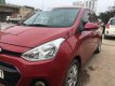 Hyundai Grand i10 2015 - Cần bán gấp Hyundai Grand i10 2015, màu đỏ