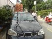 Daewoo Lacetti 2004 - Bán ô tô Daewoo Lacetti sản xuất 2004, màu đen số sàn