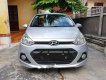 Hyundai Grand i10 2014 - Cần bán lại xe Hyundai Grand i10 đời 2014, màu bạc xe gia đình