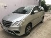 Toyota Innova E 2015 - Cần bán lại xe Toyota Innova E sản xuất 2015, màu bạc xe gia đình