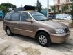 Kia Carnival GS 2009 - Cần bán xe Kia Carnival GS sản xuất 2009, màu vàng số tự động giá cạnh tranh