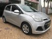 Hyundai i10 1.0MT Base 2014 - Cần bán gấp Hyundai i10 1.0MT Base 2014, màu bạc chính chủ