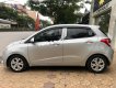 Hyundai i10 1.0MT Base 2014 - Cần bán gấp Hyundai i10 1.0MT Base 2014, màu bạc chính chủ