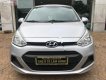 Hyundai i10 1.0MT Base 2014 - Cần bán gấp Hyundai i10 1.0MT Base 2014, màu bạc chính chủ