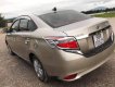 Toyota Vios   2015 - Cần bán Toyota Vios sản xuất năm 2015, màu vàng số sàn

