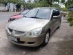 Mitsubishi Lancer GLX 1.6  2003 - Cần bán xe Mitsubishi Lancer GLX 1.6 sản xuất 2003, màu vàng, xe nhập, giá 215tr