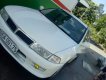 Mitsubishi Lancer  MT 2000 - Cần bán lại xe Mitsubishi Lancer MT năm sản xuất 2000, màu trắng, máy phun xăng không hao xăng